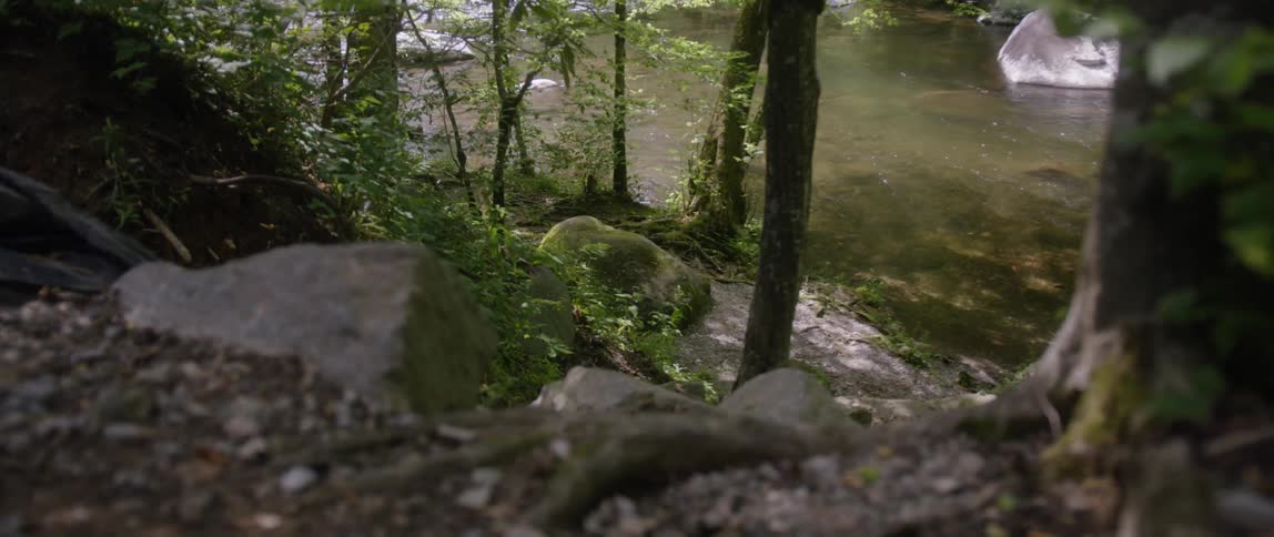 The rocks lead to the small stream