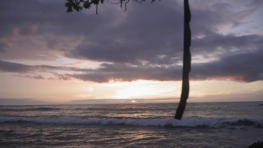 The sun sets over an ocean