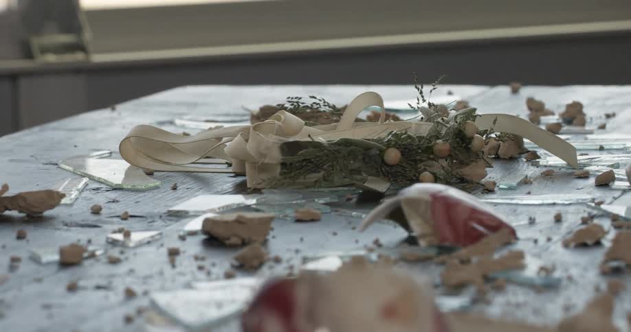 A headpiece is thrown on a messy floor