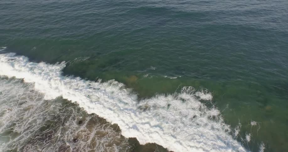 Waves crash onto a beach