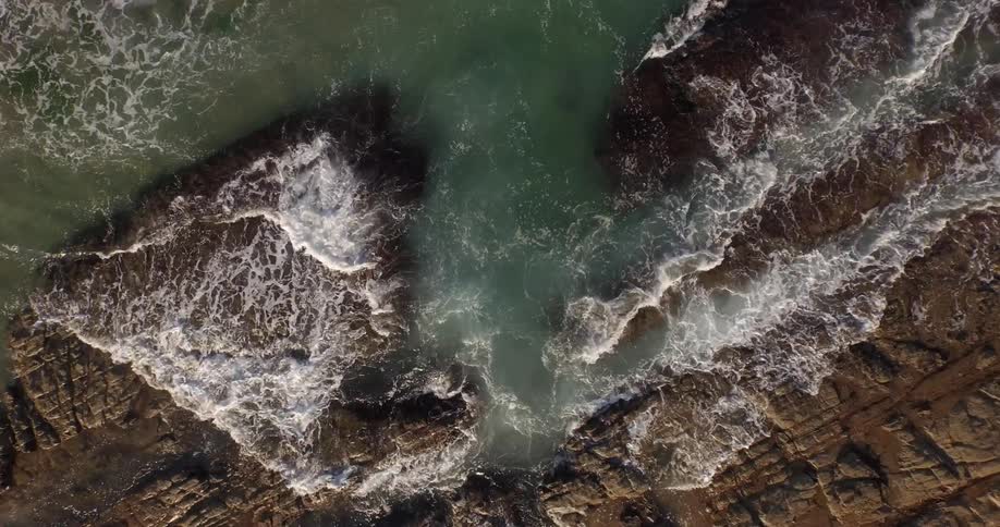 Waves crash onto a rocky beach