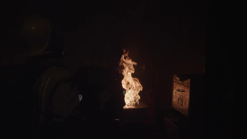 Fire burns brightly outside at night