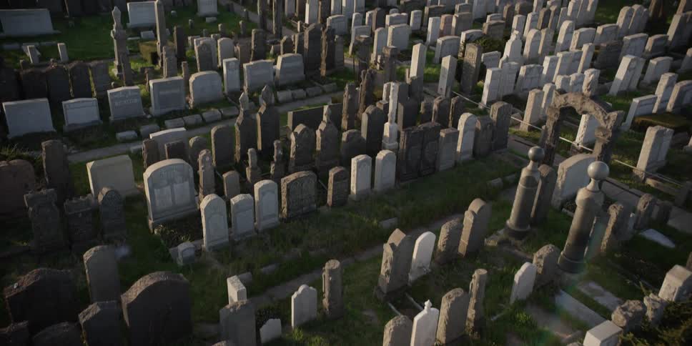 An overhead shot of a graveyard with a lot of tombstones