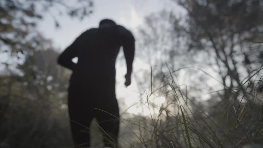 The man runs into the forest