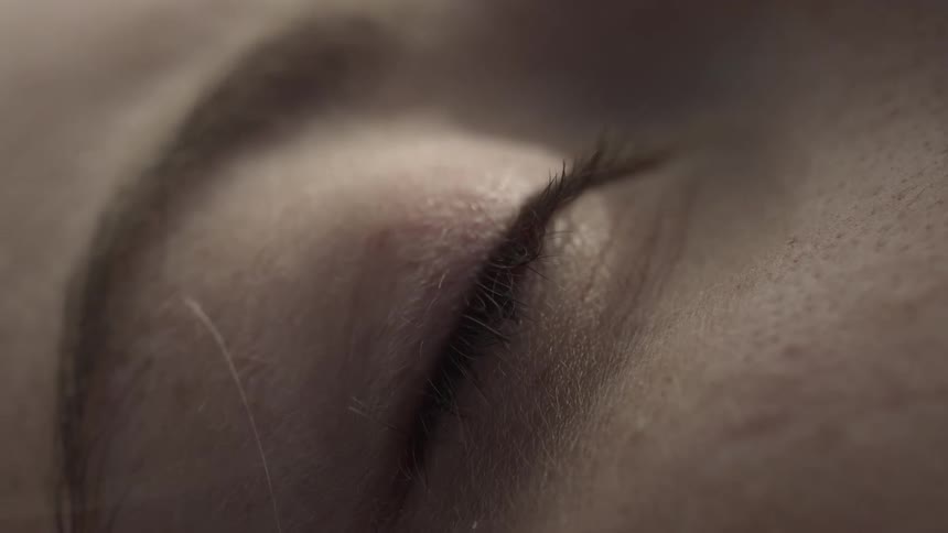 The person is resting with their eyes closed