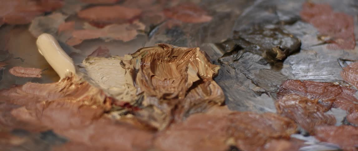Thick paint covers a paint palette