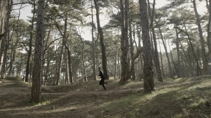 Man Running Through Forest And Dunes