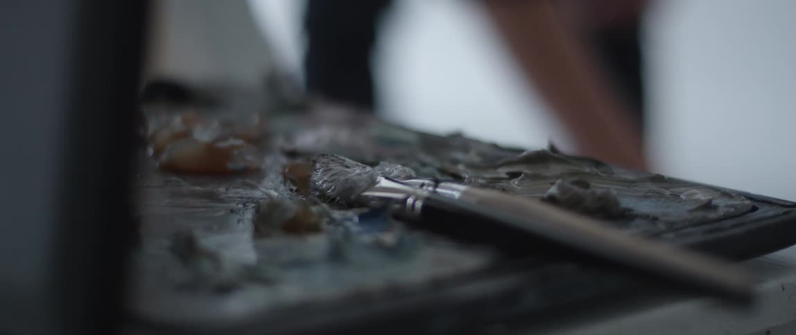 The brushes lay in the paint