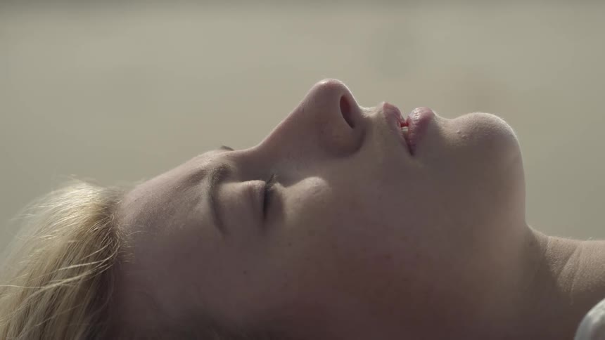 The woman is sleeping on a sunny day