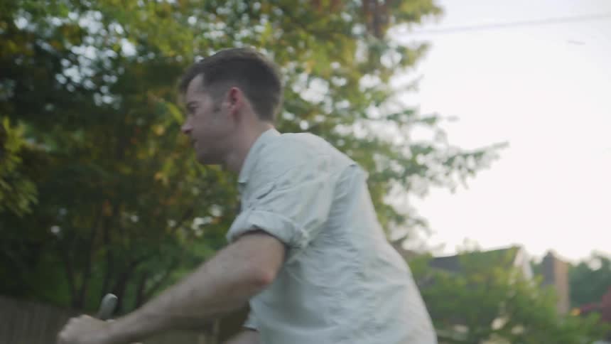 Man Struggles to Push Lawnmower