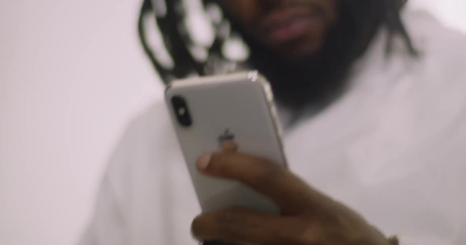 The person is using his cell phone