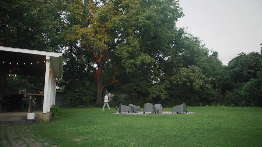 The man is mowing the large yard