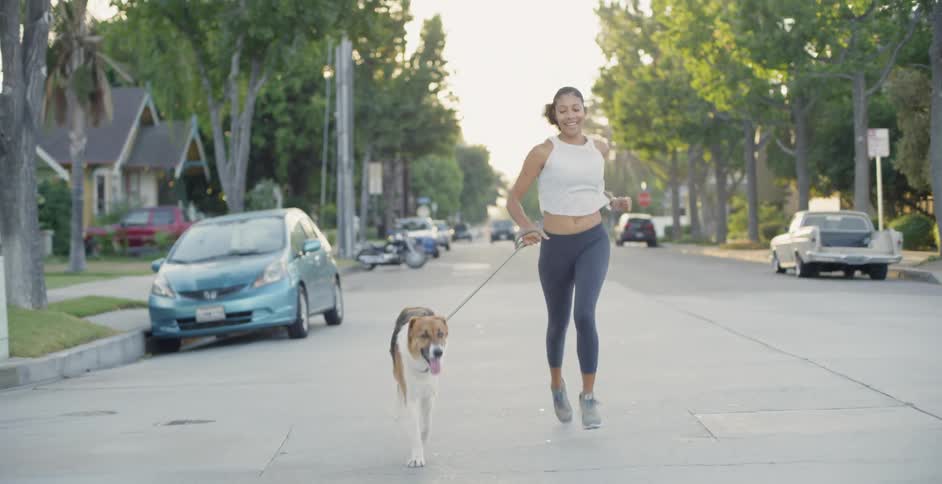 Woman Jogging With Dog