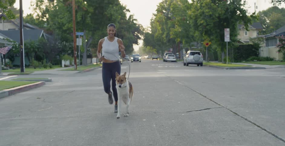 Woman Jogging With Dog