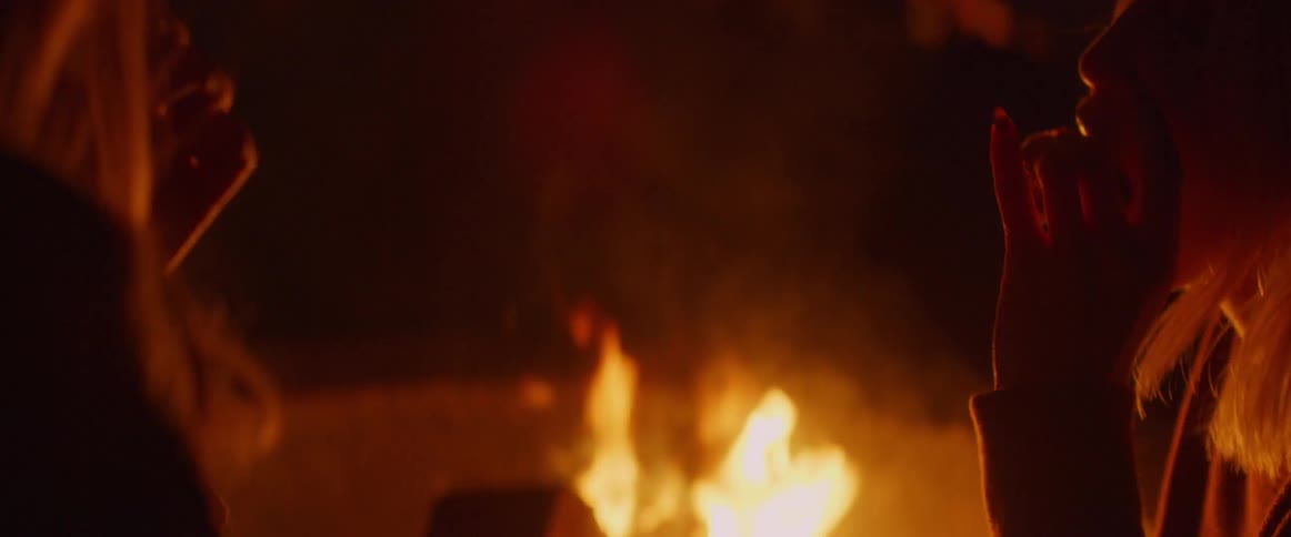 The people sit around campfires eating