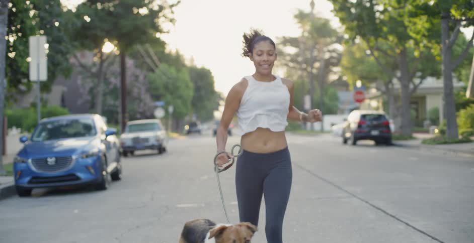 Woman Jogging With Dog