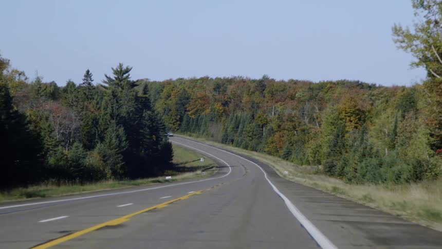 The vehicles travel around the road