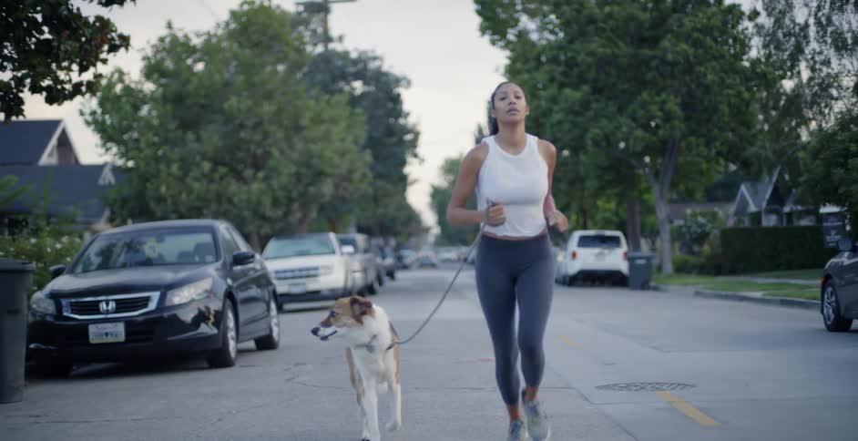Woman Jogging With Dog
