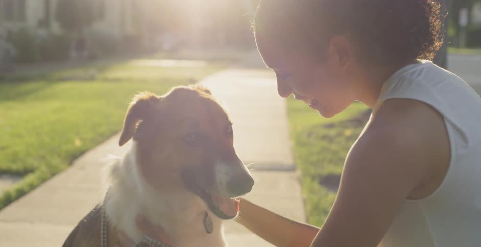 A woman petting her dog