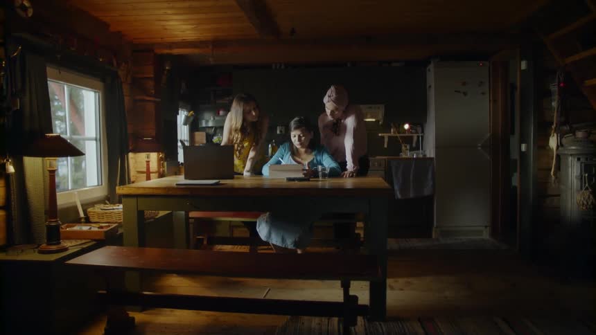 Several woman in a kitchen working