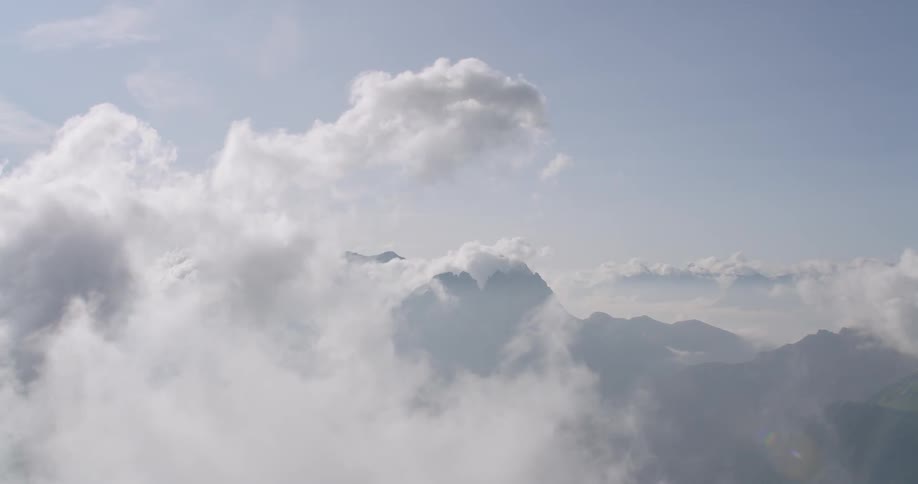 Clouds are floating in sky over mountain range