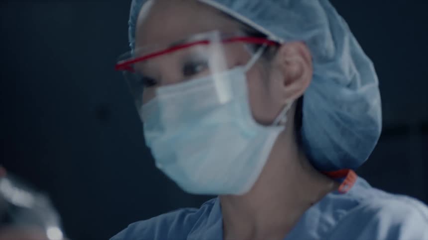 A female doctor preparing a patient