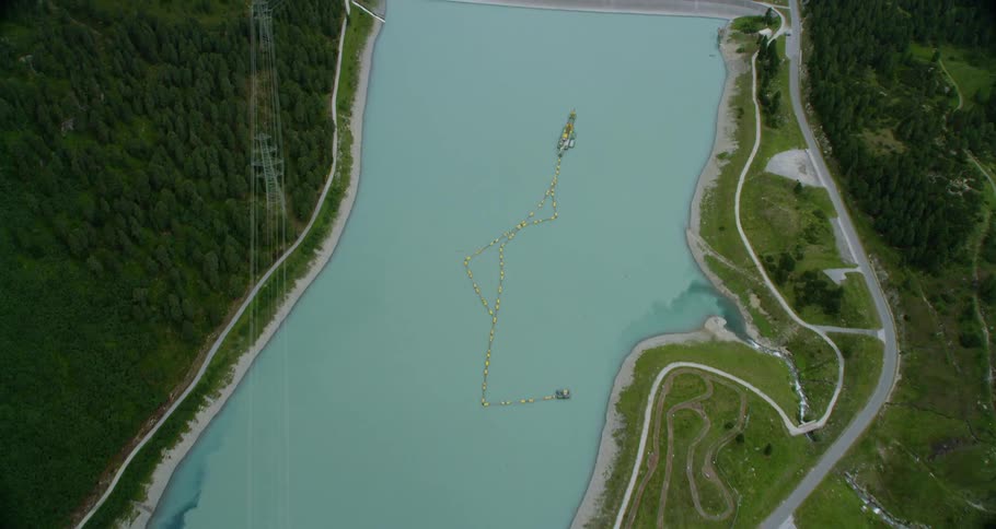 Large dam of water overlooking landscape below
