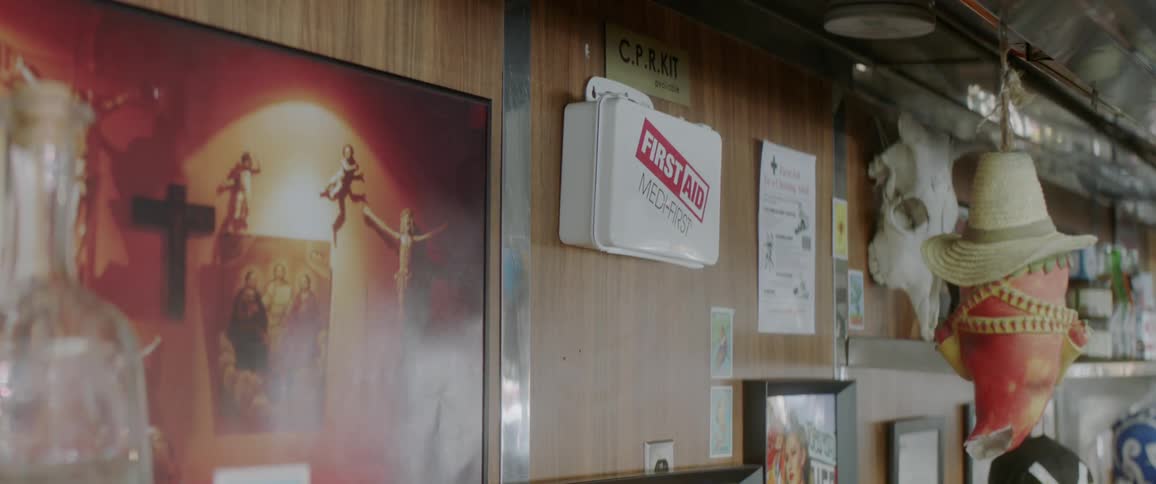 A first aid kit is hanging on the wall