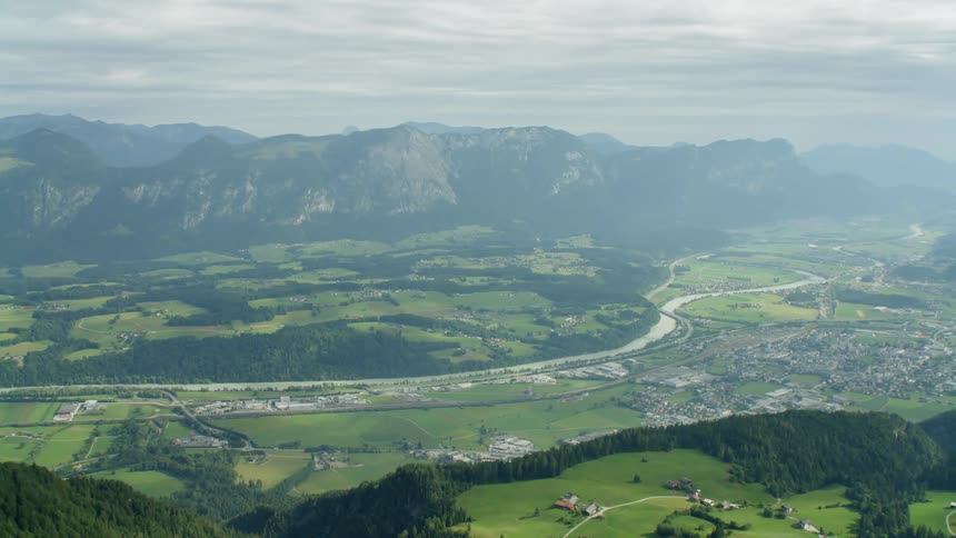 Small village surrounded by grassy mountains