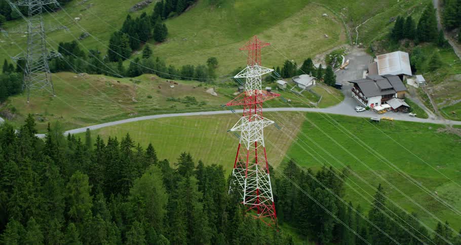 Power lines extending across a rural valley