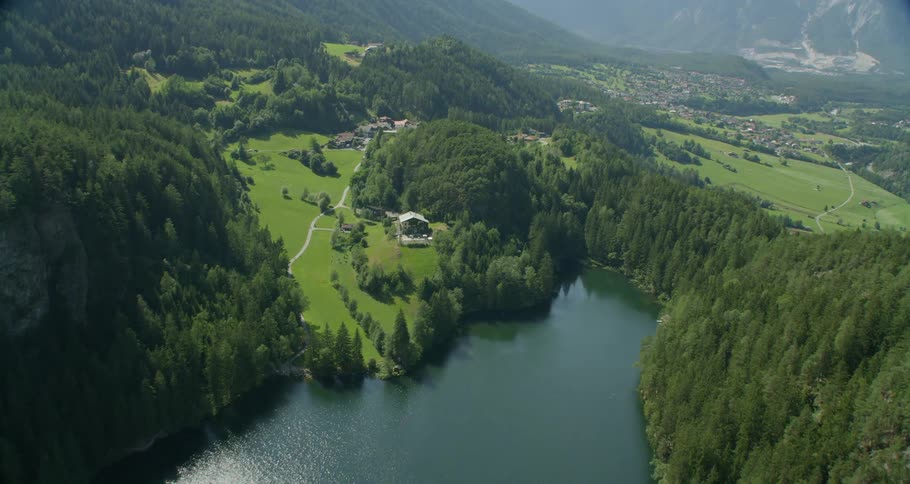The lake is centered between dense forests