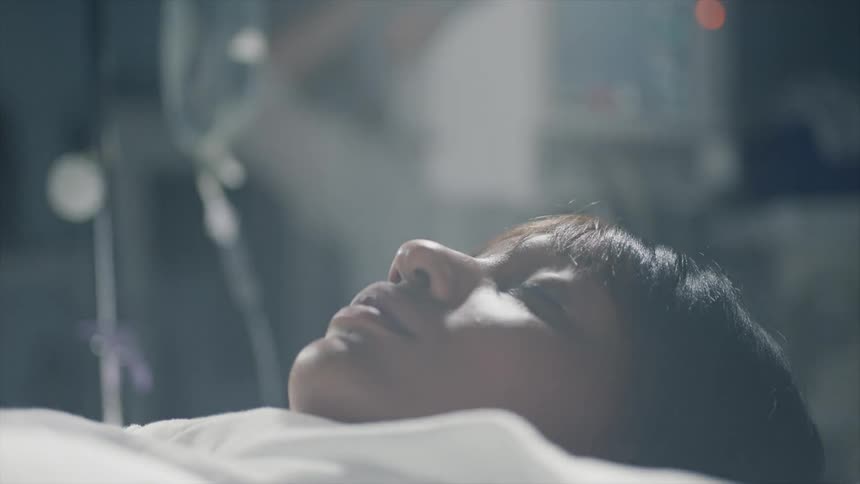 A woman laying in a hospital bed