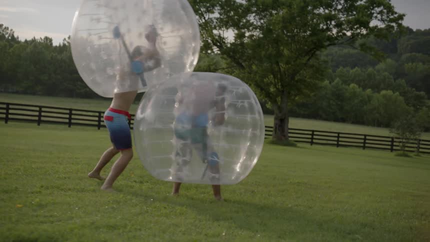 The two men bounce off each other in enlarged bubbles