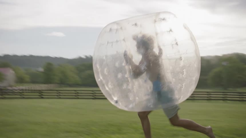 The two people collide wearing inflatable bubbles