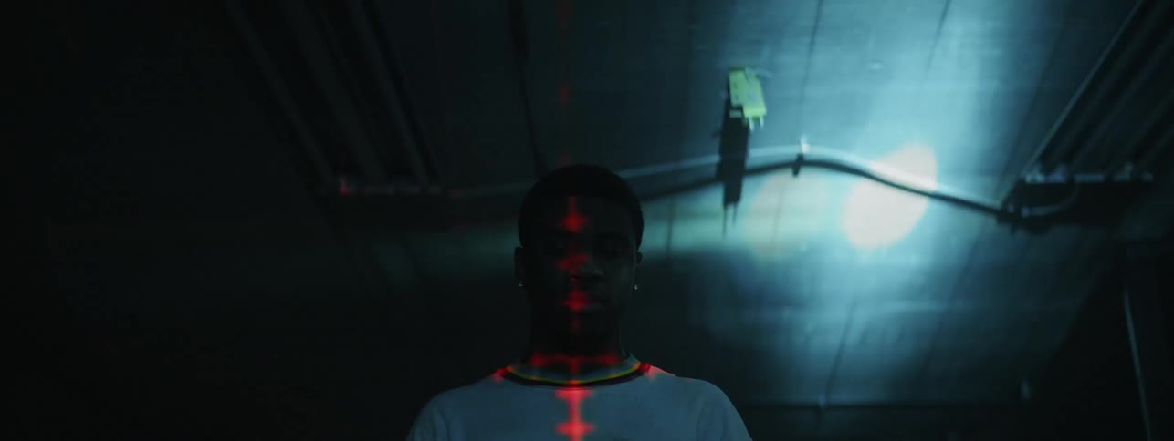 The man has a red cross light on him