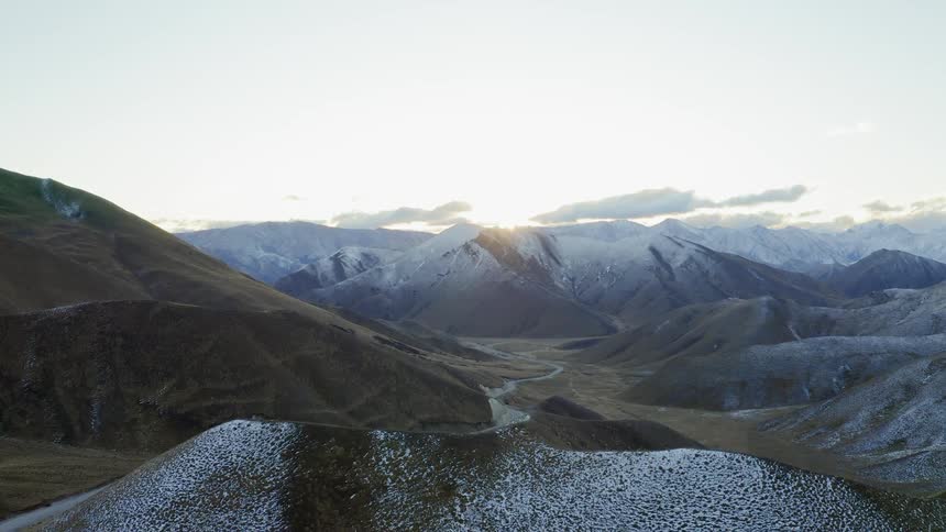 The hills are covered in slight snow