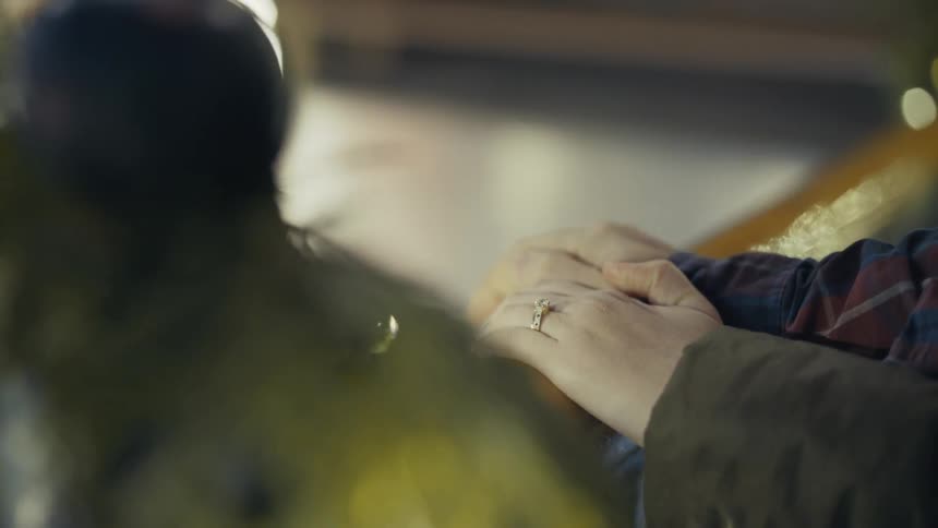 A person grasping a railing