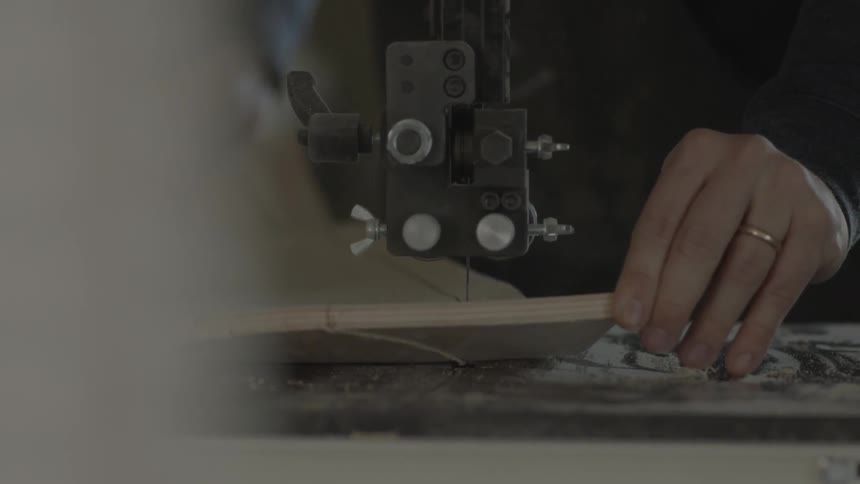 A person using a sewing machine to bind clothes