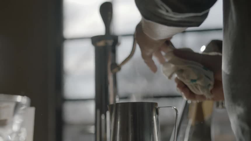 A person cleans a spout