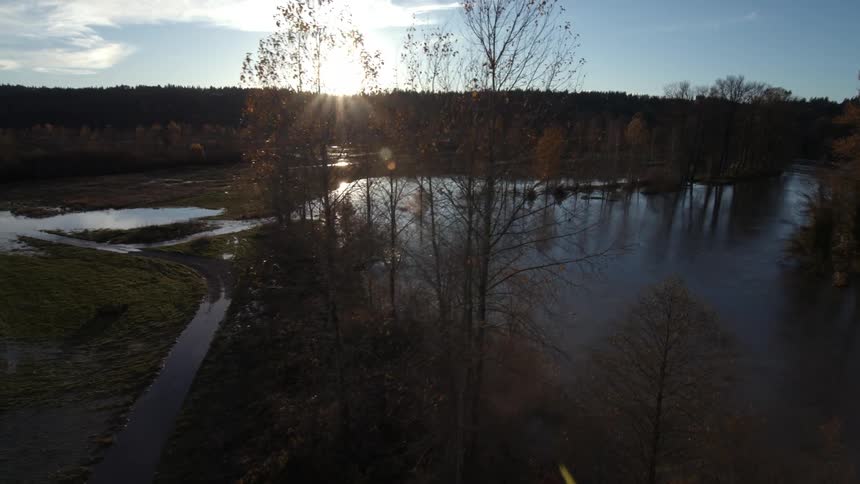 A marsh runs alongside a river