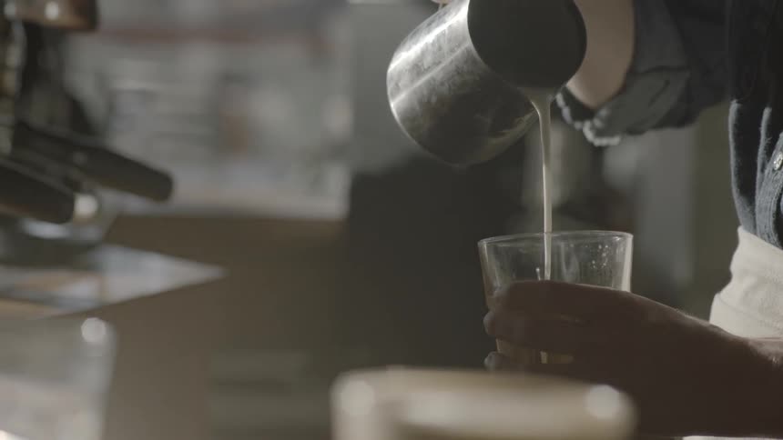 A man prepares a coffee