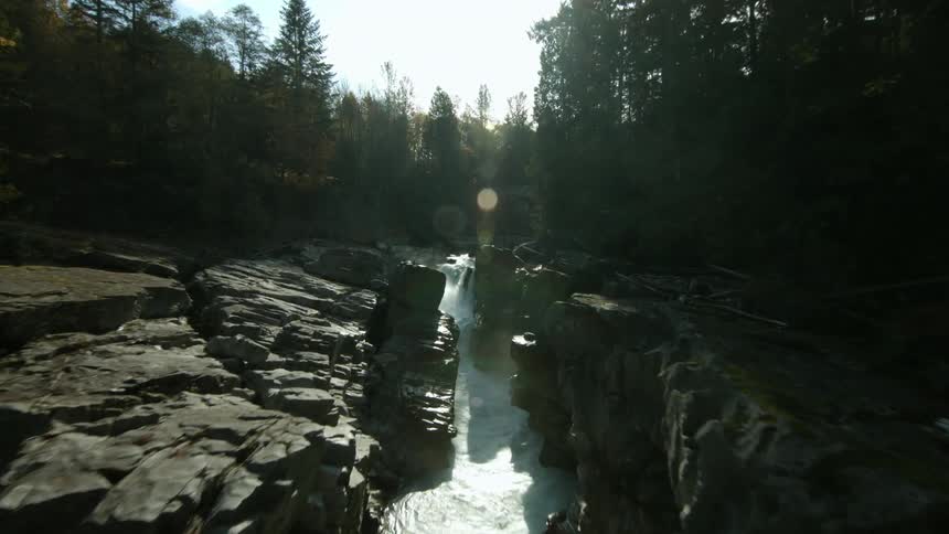 A waterfall cascades over a mountain