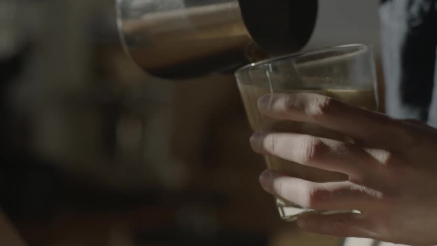 Someone is pouring milk