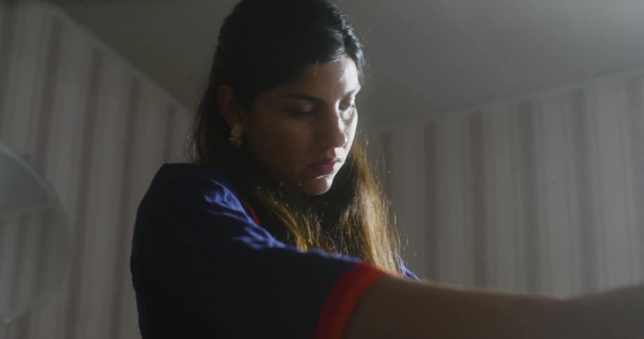 Woman looking at her clothes trying to choose one