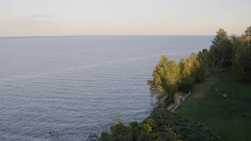 Water flows next to a grassy shore