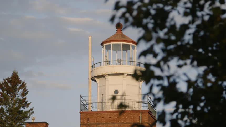 A lighthouse that is on top of a building