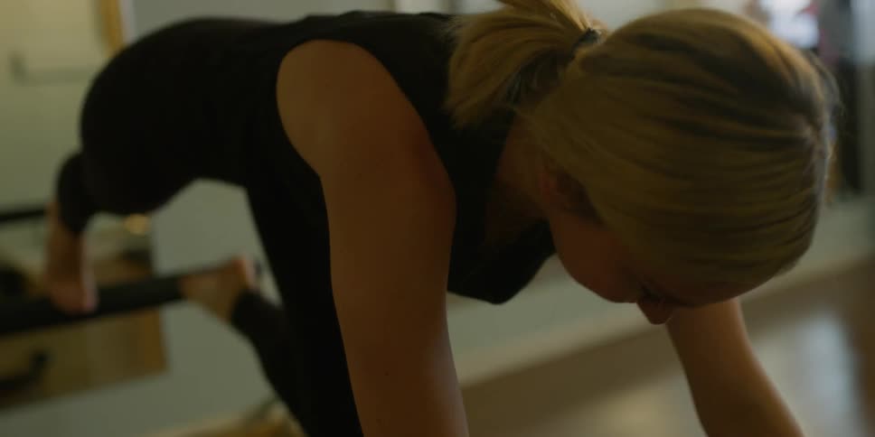 Woman smiling while exercising