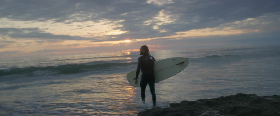 Man Meditating And Surfing
