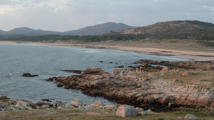 The deserted beach is rocky and unwelcoming