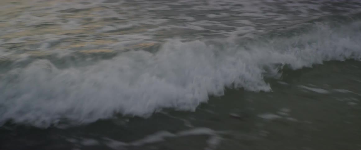 Waves rolling over a calm sea